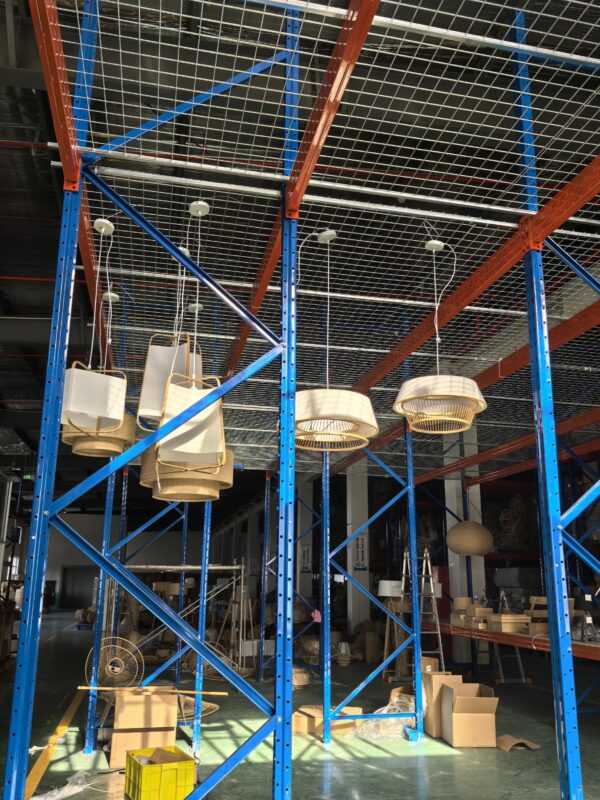 Lighting factory warehouse in China displaying pendant lamps and custom lighting products for export