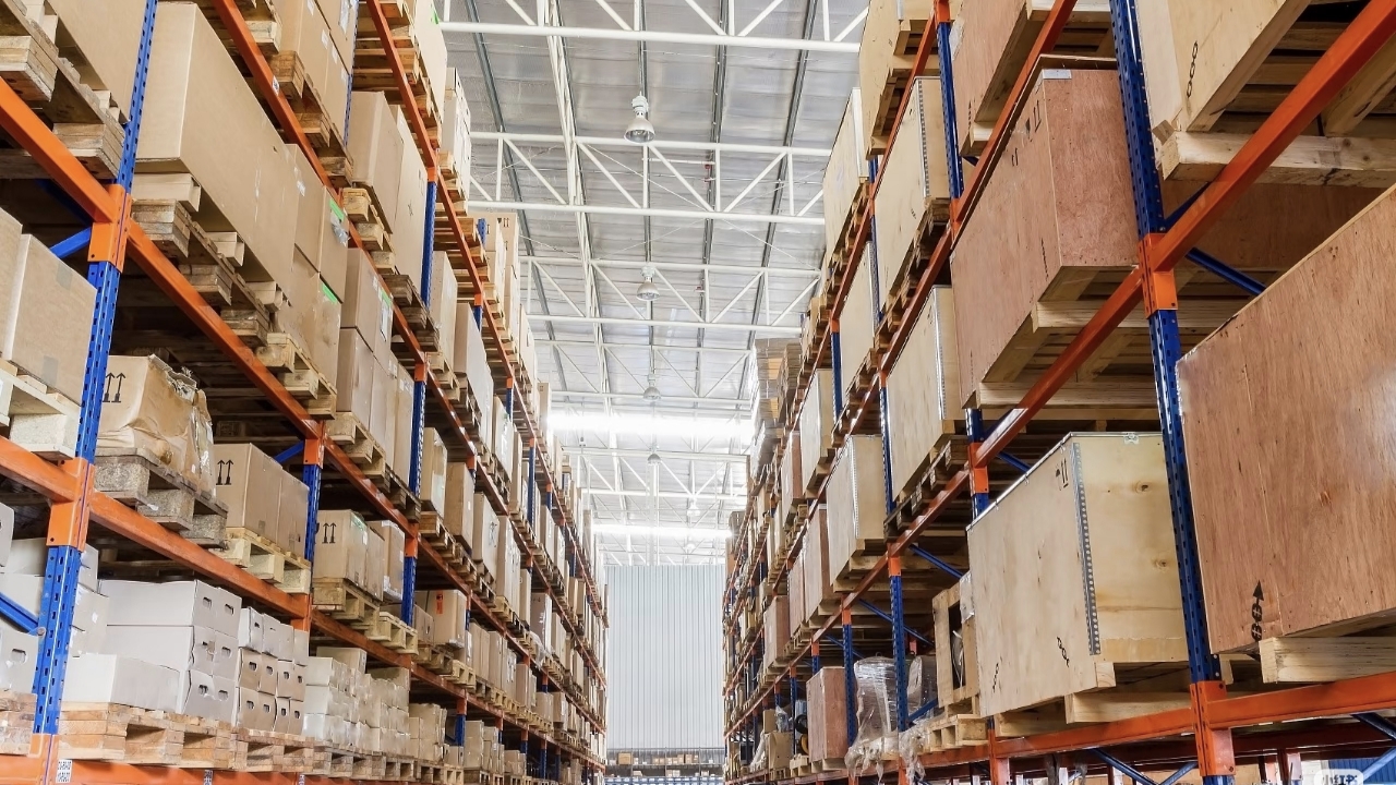 High-bay warehouse with extensive shelving used for long-term storage of boxed materials